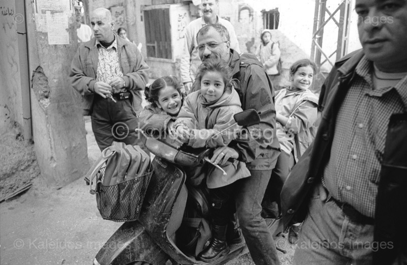Children;Kaleidos images;Man;Men;Mopeds;Palestinian Refugees;Palestinians;Refugee camps;Shatila;Tarek Charara;UNRWA