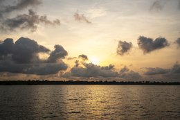 Lake-Toho;Ouidah;Benin;West-Africa;sunset;golden-hour;clouds;dramatic-sky;cumulus;orange-light;lake-landscape;nature;reflection;no-people;travel;Tarek-Charara;Kaleidos;Kaleidos-images;La-parole-à-limage