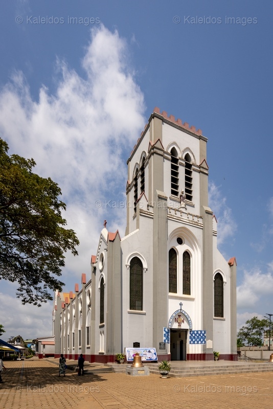 Benin, Ouidah, basilica, Basilica of the Immaculate Conception, Neo-Gothic architecture, Catholic church, façade, bell tower, Latin cross, religious heritage, West Africa, missionaries, SMA, Society of African Missions, Louis Dartois, François Steinmetz, minor basilica, 1903, 1909, John Paul II, exterior, colonial architecture, Dahomey;places of worship,Churches
