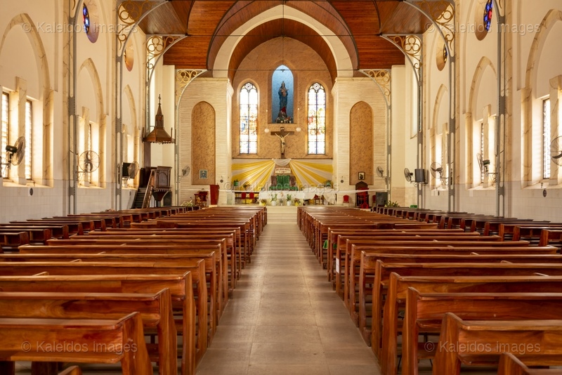 Benin, Ouidah, Basilica of the Immaculate Conception, interior, nave, chancel, altar, vault, Neo-Gothic architecture, stained glass, Madonna of Ouidah, statue, cross, apse, religious heritage, West Africa, minor basilica, 1909, Tarek Charara;Kaleidos;Kaleidos images;La parole à l'image;Places of worship