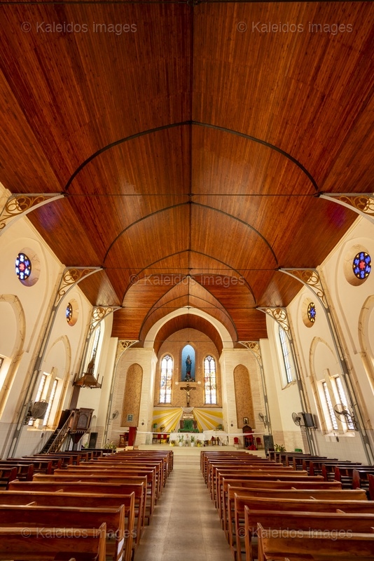 Benin, Ouidah, Basilica of the Immaculate Conception, interior, nave, chancel, altar, vault, Neo-Gothic architecture, stained glass, Madonna of Ouidah, statue, cross, apse, religious heritage, West Africa, minor basilica, 1909, Tarek Charara;Kaleidos;Kaleidos images;La parole à l'image;Places of worship