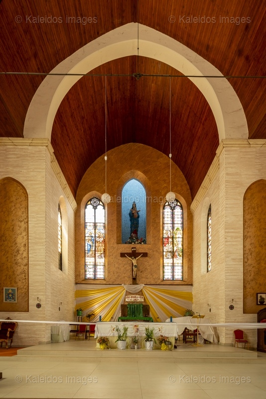 Benin, Ouidah, Basilica of the Immaculate Conception, interior, nave, chancel, altar, vault, Neo-Gothic architecture, stained glass, Madonna of Ouidah, statue, cross, apse, religious heritage, West Africa, minor basilica, 1909, Tarek Charara;Kaleidos;Kaleidos images;La parole à l'image;Places of worship