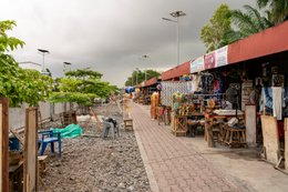 Alley;-Artisan-market;-Benin;-Cotonou;-Craft-stall;-Fabric;-Gbegamey;-Kaleidos;-Kaleidos-images;-La-parole-à-limage;-Marché-des-arts;-Railway;-Red-fascia-band;-Shop;-Tarek-Charara