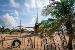 Abandoned-aircraft;-Airplane-wreck;-Backlight;-Barakah;-Benin;-Cadjéhoun-Beach;-Coconut-palm;-Corrosion;-Cotonou;-Cotonou-airport;-Engine;-Kaleidos;-Kaleidos-images;-La-parole-à-limage;-Lockheed-L-1011;-Tail-assembly;-Tarek-Charara;-TriStar;-Vertical-fin;-West-Africa