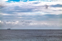 Atlantic-Ocean;-Benin;-Boat;-Cargo-ship;-Clouds;-Cloudy-sky;-Coastline;-Corniche-Est;-Cotonou;-Gulf-of-Benin;-Horizon;-Kaleidos;-Kaleidos-images;-La-parole-à-limage;-Sea;-Ship;-Stories-Pictures;-Tarek-Charara;-West-Africa