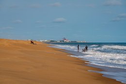 Atlantic-Ocean;-Bathing;-Beach;-Benin;-City;-Coastline;-Cotonou;-Fidjrossè;-Gulf-of-Guinea;-Kaleidos;-Kaleidos-images;-La-parole-à-limage;-Late-afternoon;-Ochre-sand;-Route-des-Pêches;-Stories-Pictures;-Tarek-Charara;-Urban-silhouette;-Wave;-West-Africa
