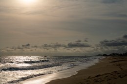 Atlantic-Ocean;-Beach;-Benin;-Boat;-Calm-sea;-Coastline;-Cotonou;-Fidjrossè;-Footprints;-Gulf-of-Guinea;-Kaleidos;-Kaleidos-images;-La-parole-à-limage;-Late-afternoon;-Reflection;-Route-des-Pêches;-Silvery-light;-Stories-Pictures;-Tarek-Charara;-West-Africa