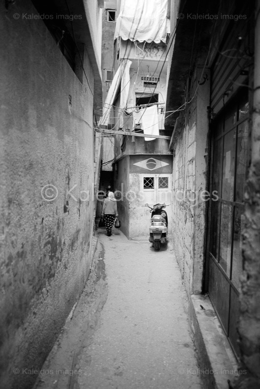 Alleys;Architecture;Kaleidos images;Mopeds;Palestinian Refugees;Palestinians;People;Refugee camps;Shatila;Tarek Charara;UNRWA;Woman;Women