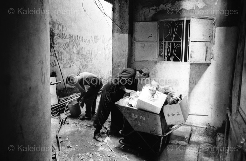 Alleys;Clean;Cleaning;Kaleidos images;Man;Men;Palestinian Refugees;Palestinians;Penumbra;Refugee camps;Shatila;Tarek Charara;UNRWA;Waste;Garbage