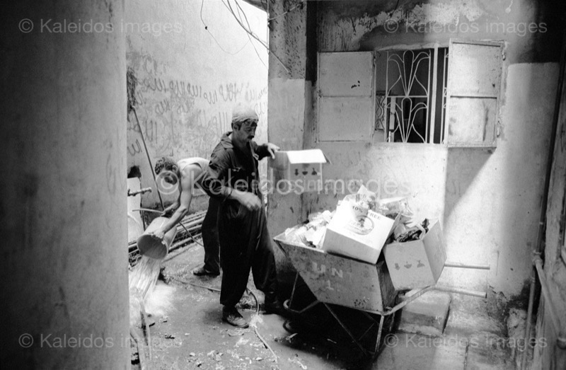 Alleys;Clean;Cleaning;Kaleidos images;Man;Men;Palestinian Refugees;Palestinians;Penumbra;Refugee camps;Shatila;Tarek Charara;UNRWA;Waste;Garbage