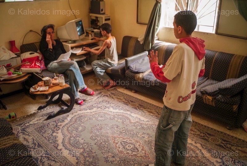 Computers;Homework;Jihad Al Hindawi;Jihad Hindawi;Kaleidos images;Mona Al Hindawi;Mona Hindawi;Nidal Al Hindawi;Nidal Hindawi;Palestinian Refugees;Palestinians;Refugee camps;Shatila;Tarek Charara;UNRWA